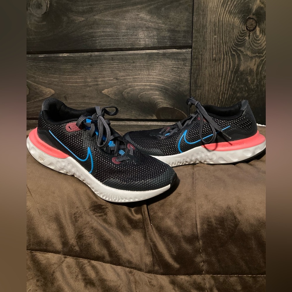 Nike brand, size 6Y, comfortable athletic shoes, black, blue and pink.